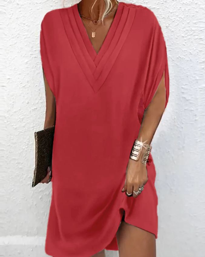 Elegante vestido liso con mangas con aberturas