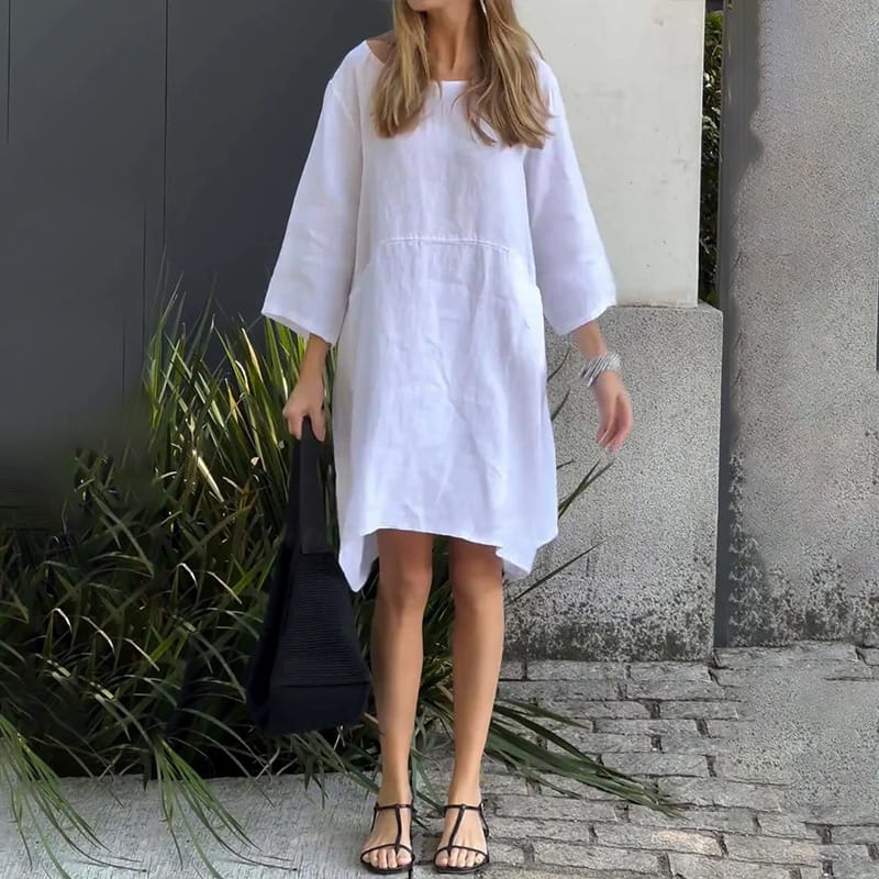 Vestido de mujer en color liso, corte holgado y con bolsillo.