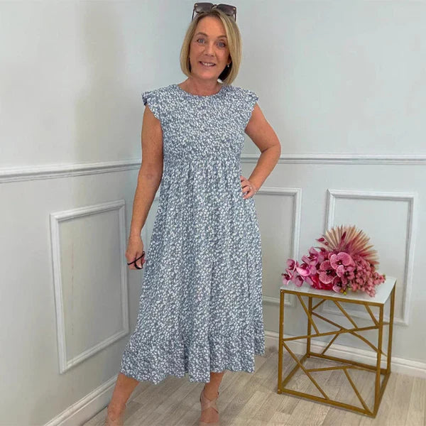 Elegante vestido con estampado floral, cintura alta y mangas con volantes