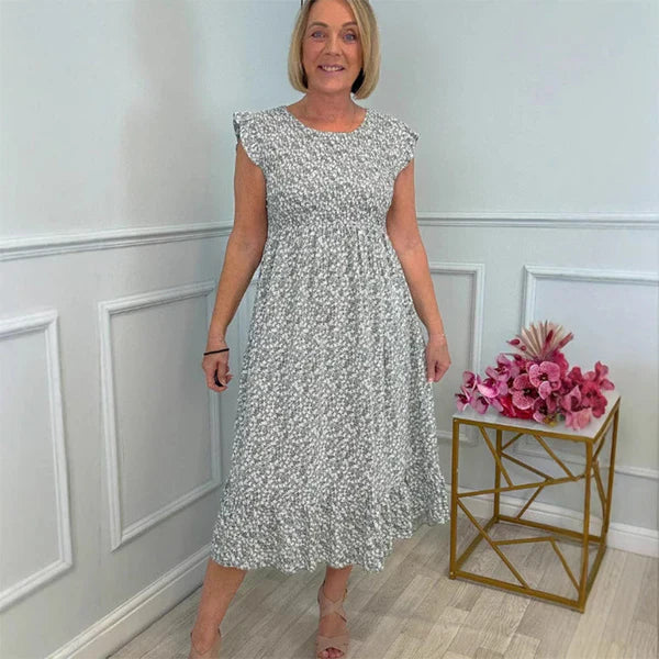 Elegante vestido con estampado floral, cintura alta y mangas con volantes